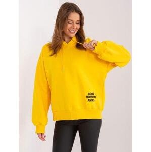 Fashionhunters Žlutá zateplená oversize mikina s kapucí a nápisem Velikost: S