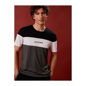 Koton Sports T-shirt with the slogan printed. Color Block Crew Collar Breathable Fabric.