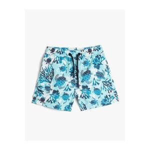 Koton Marine Shorts with a Tie Waist Turtle Printed Mesh Lined.