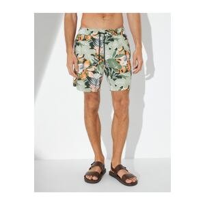 Koton Marine Shorts with Leaf Print. A drawstring waist with pockets.