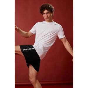 Koton Sports Shorts The waist is laced, pockets, slogan printed, breathable fabric.