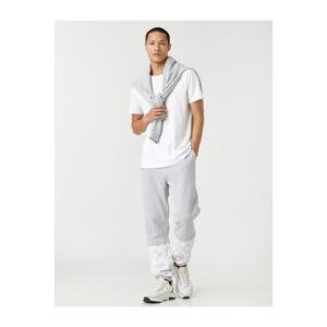 Koton Basic Jogger Sweatpants with Lace-Up Waist and Floral Print.
