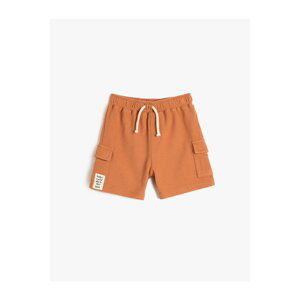 Koton The shorts are tied at the waist, elasticized, side pockets, textured cotton.