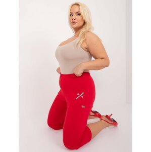 Červené vypasované kalhoty o velikosti 3/4 plus