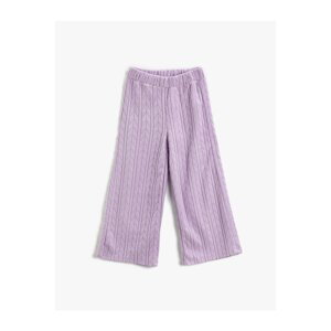Koton The Wide Leg Trousers have a relaxed fit. The waist is elasticated, textured.